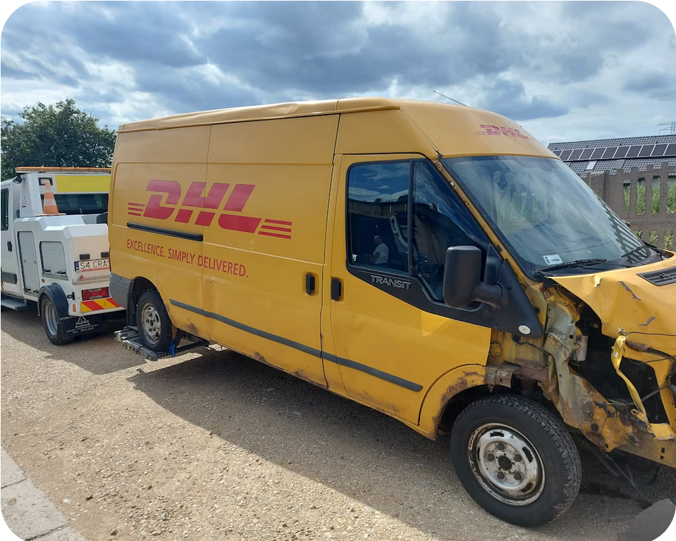 Accident recovery flatbed tow of a damaged van in Colorado Springs